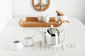 White teapots in white home interiors 